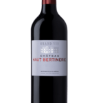 Bouteille de Château Haut Bertinerie Grand Vin 2018 avec une étiquette argentée et des écritures rouges et argentées.