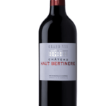 Bouteille de Château Haut Bertinerie Grand Vin 2019 avec une étiquette argentée et des écritures rouges et argentées.